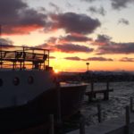 The sunset over Leland's harbor 