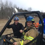 Sergeant Herman and Firefighter Plamondon pose for a picture during a training scenario